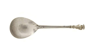 Dining ware made from silver was more valuable than wooden or pewter items and was therefore a key asset for improving worth. Apostle spoons were often given as baptism gifts and then bequeathed to heirs in wills. They were usually old, inherited items with rich symbolic significance associated with rites of passage in the lifecycle (birth and death). A tiny depiction of one of the biblical apostles could be found on the spoons final.<br />
<br />
Wealthier people had sets of apostle spoons (up to the full set of 12, or 13 if the set included Christ). Gifts of individual spoons were more common in middling groups. They might be associated with specific family members (possibly sharing the name of the depicted saint on the handle) and could be engraved with initials.<br />
<br />
The spoon is especially valuable in linking the religious significance of subject matter with familial memory. Spoons for practical use would be carried around on the person, but this sort of special spoon would be stored to it keep safe (in a chest for instance). This spoon has the figure of St John and bears the initials J G on the underside of the bowl.   